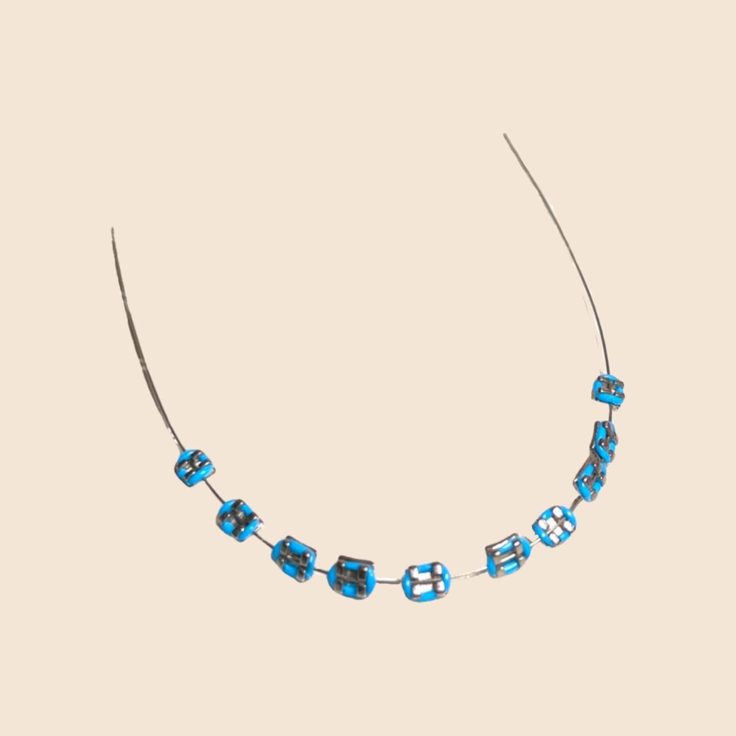 Blue handmade doll braces with metallic brackets on a wire, shown as a color variant in a DIY cosplay tooth accessory kit for The monster Labubu dolls. Includes adhesive tools. Doll not included.