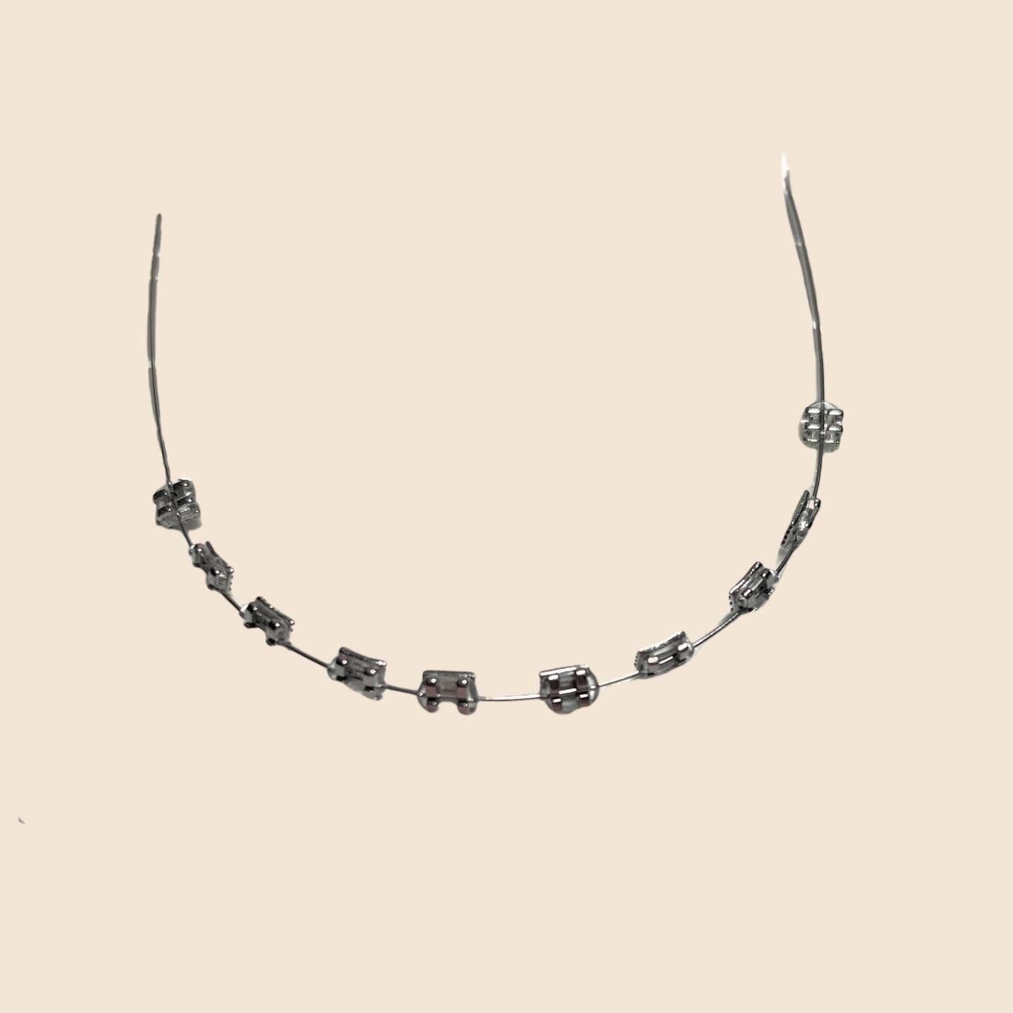 Silver handmade doll braces with metallic steel brackets on a wire, presented as a classic variant in a DIY cosplay tooth accessory kit for The monster Labubu dolls. Adhesive tools included. Doll not included.