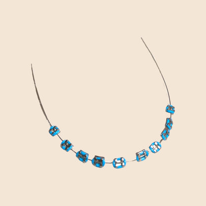 Blue handmade doll braces with metallic brackets on a wire, shown as a color variant in a DIY cosplay tooth accessory kit for The monster Labubu dolls. Includes adhesive tools. Doll not included.