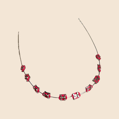 Red handmade doll braces with glossy metallic brackets arranged on wire, featured as a color variant in a DIY cosplay accessory kit forThe monster Labubu dolls. Adhesive tools included. Doll not included.