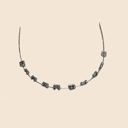 Silver handmade doll braces with metallic steel brackets on a wire, presented as a classic variant in a DIY cosplay tooth accessory kit for The monster Labubu dolls. Adhesive tools included. Doll not included.
